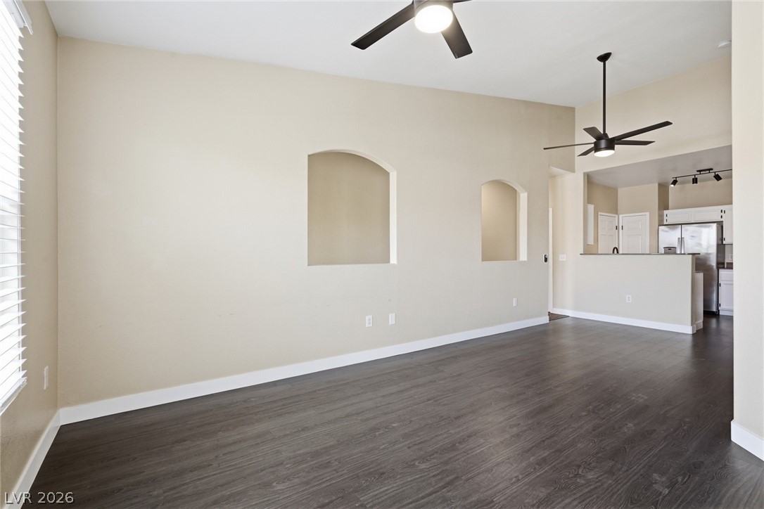 10550 West Alexander Road, Unit 2177 Las Vegas, NV 89129 - Photo 2 of 19 This airy living area features sleek wood flooring, offering seamless flow into the adjacent kitchen.
