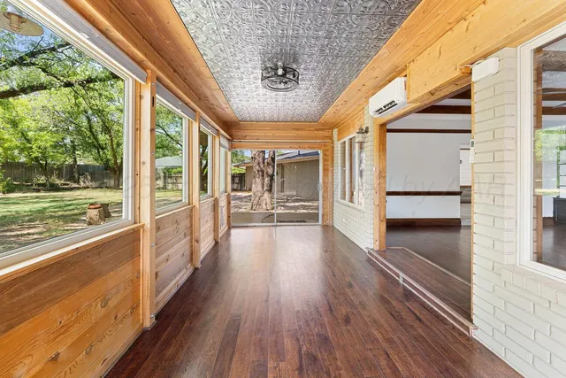 a view of a porch with wooden floor and outdoor space