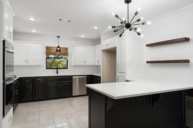a kitchen with a sink and a refrigerator