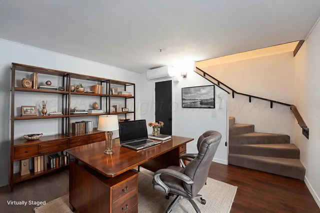 a workspace with furniture and a book shelf