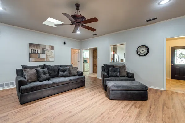 a kitchen with stainless steel appliances granite countertop a sink a stove and cabinets