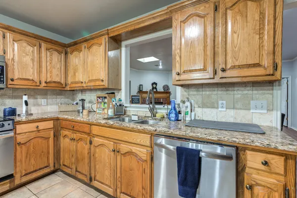 a spacious bedroom with a bed and a bathtub