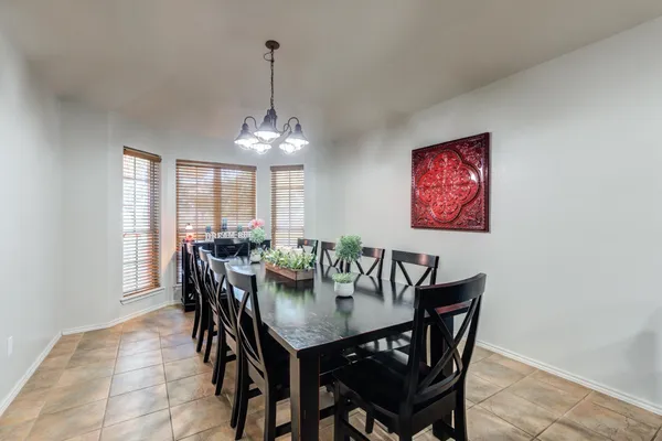 a spacious bathroom with a granite countertop sink and a mirror