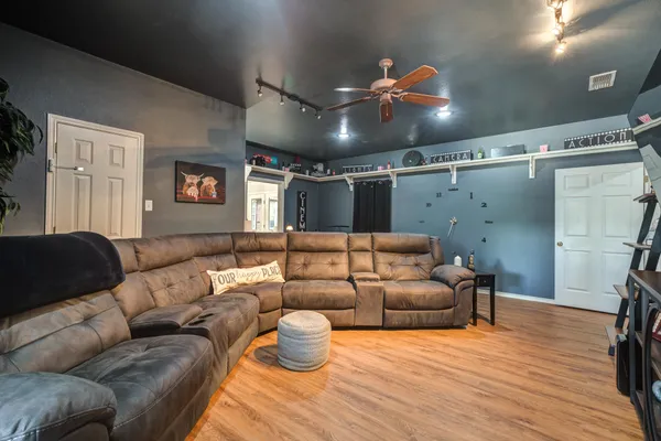 a bathroom with a granite countertop sink toilet and a mirror