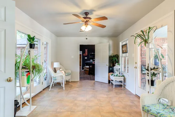 a work room with furniture and a window