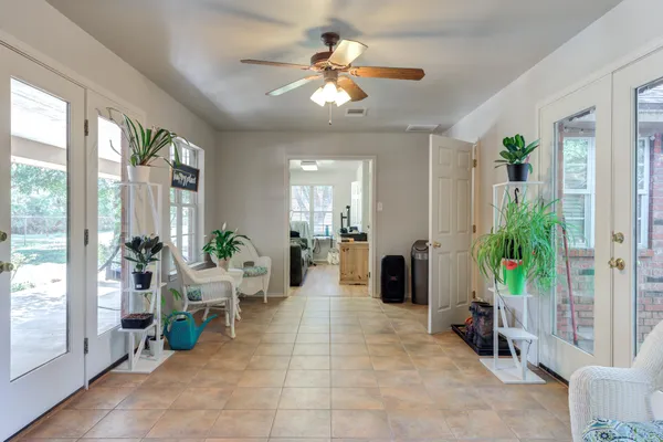 a kitchen with granite countertop white cabinets and stainless steel appliances