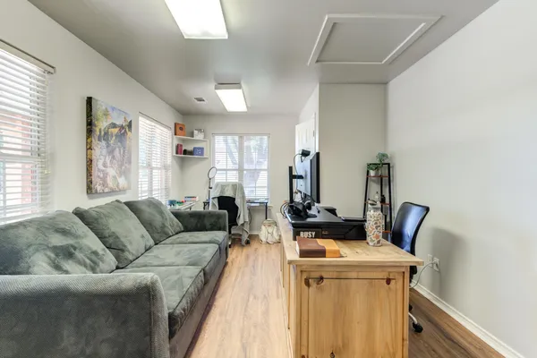 a view of a chairs and table in the backyard