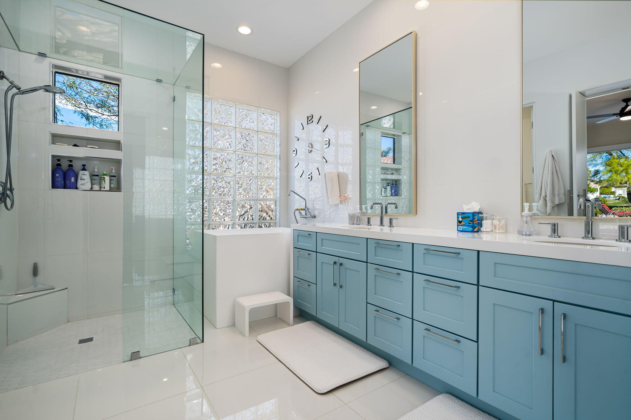 275 Loch Lomond Road Rancho Mirage, CA 92270 - Photo 15 of 29 a bathroom with a shower sink and mirror
