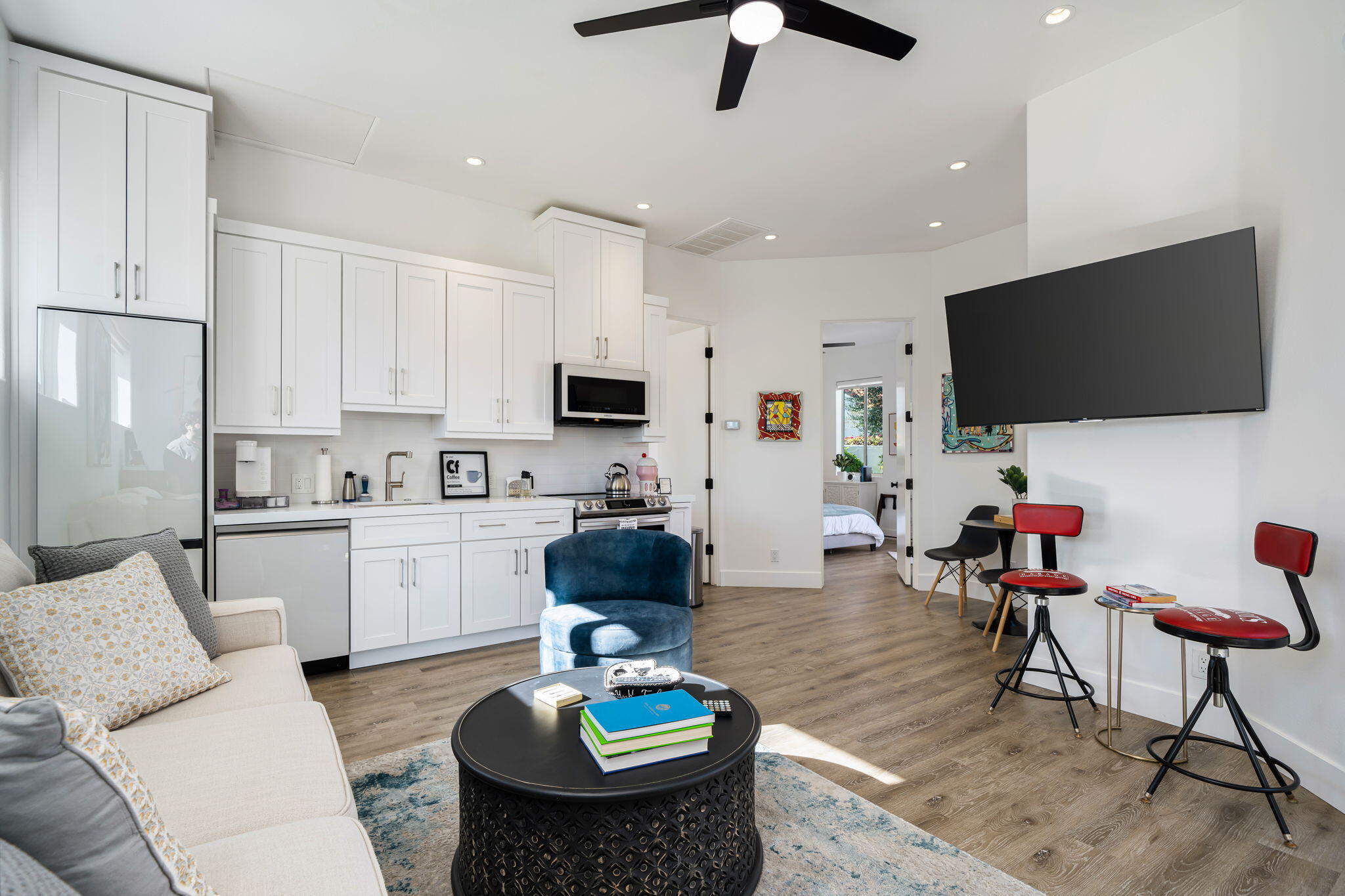 275 Loch Lomond Road Rancho Mirage, CA 92270 - Photo 20 of 29 a living room with furniture and a flat screen tv
