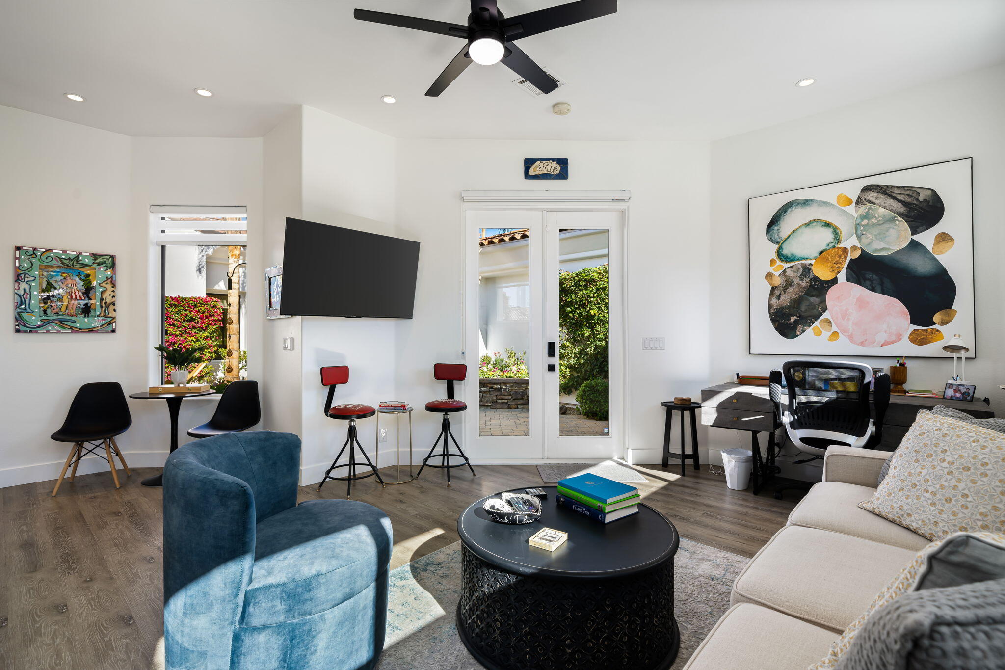 275 Loch Lomond Road Rancho Mirage, CA 92270 - Photo 22 of 29 a living room with furniture a rug and a flat screen tv