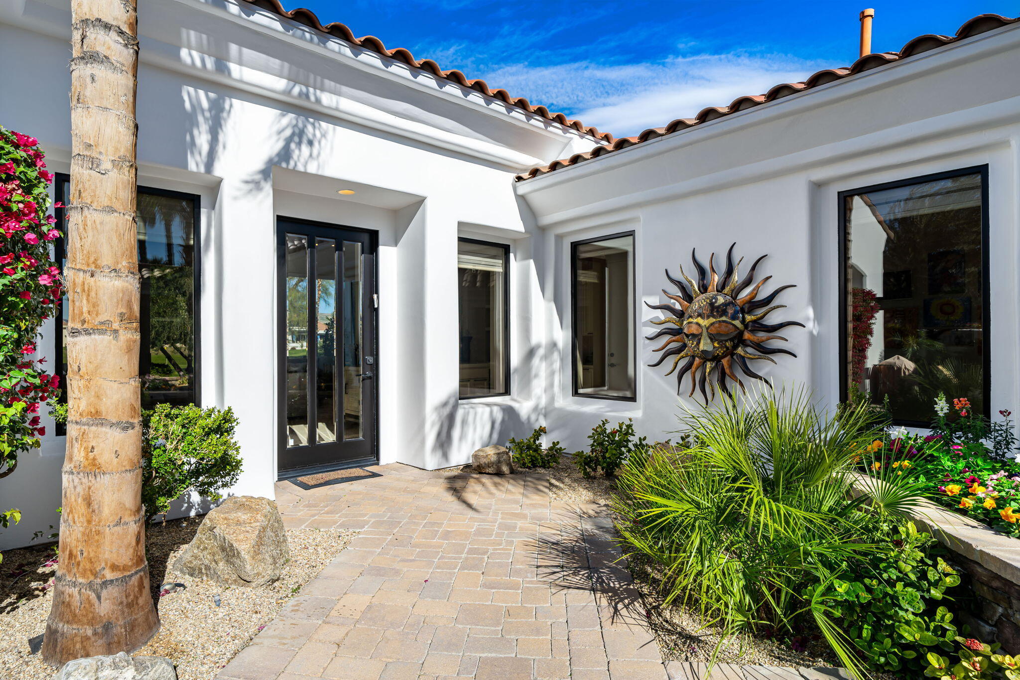 275 Loch Lomond Road Rancho Mirage, CA 92270 - Photo 5 of 29 a front view of a house with a yard