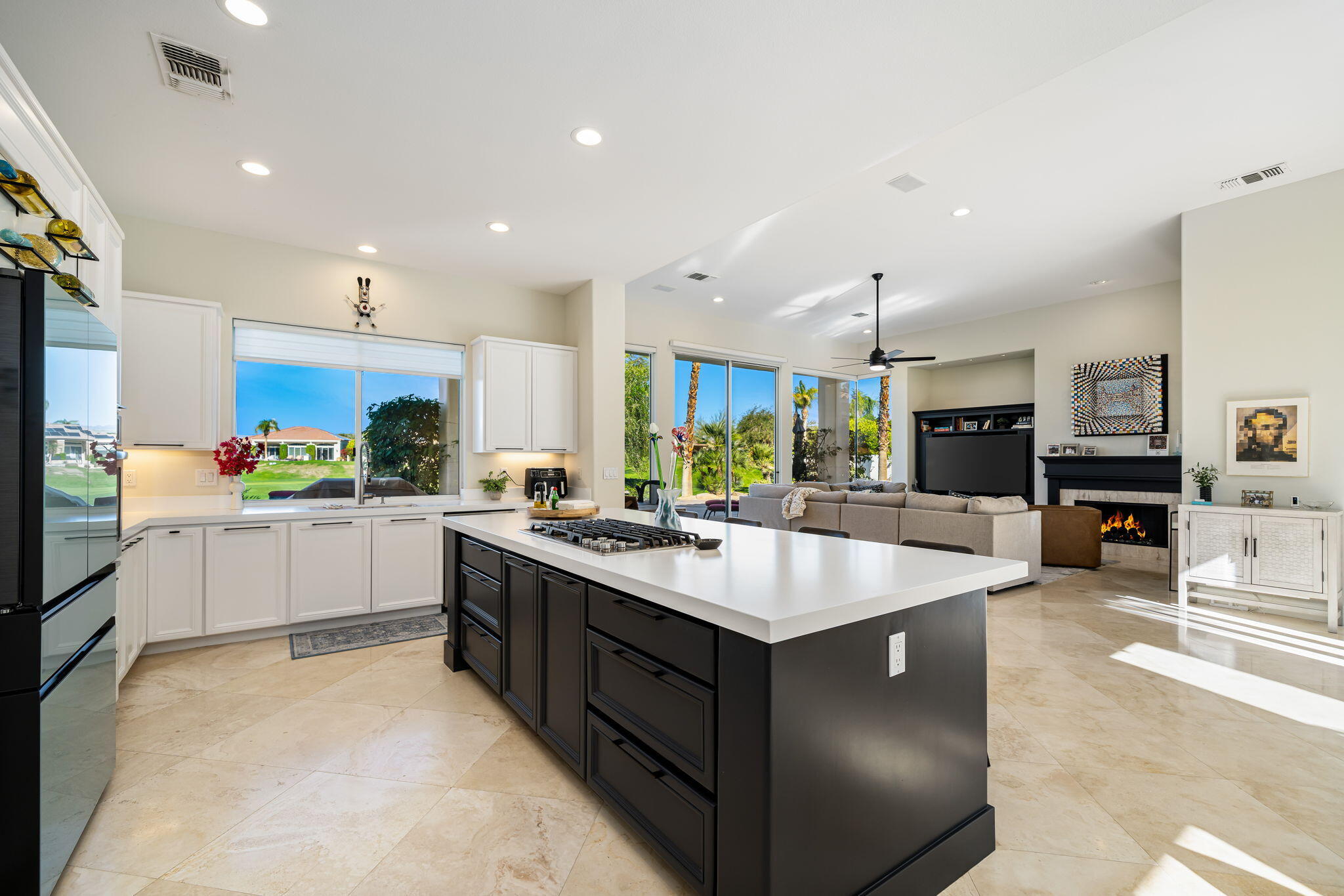 275 Loch Lomond Road Rancho Mirage, CA 92270 - Photo 7 of 29 a kitchen with a sink stove and cabinets