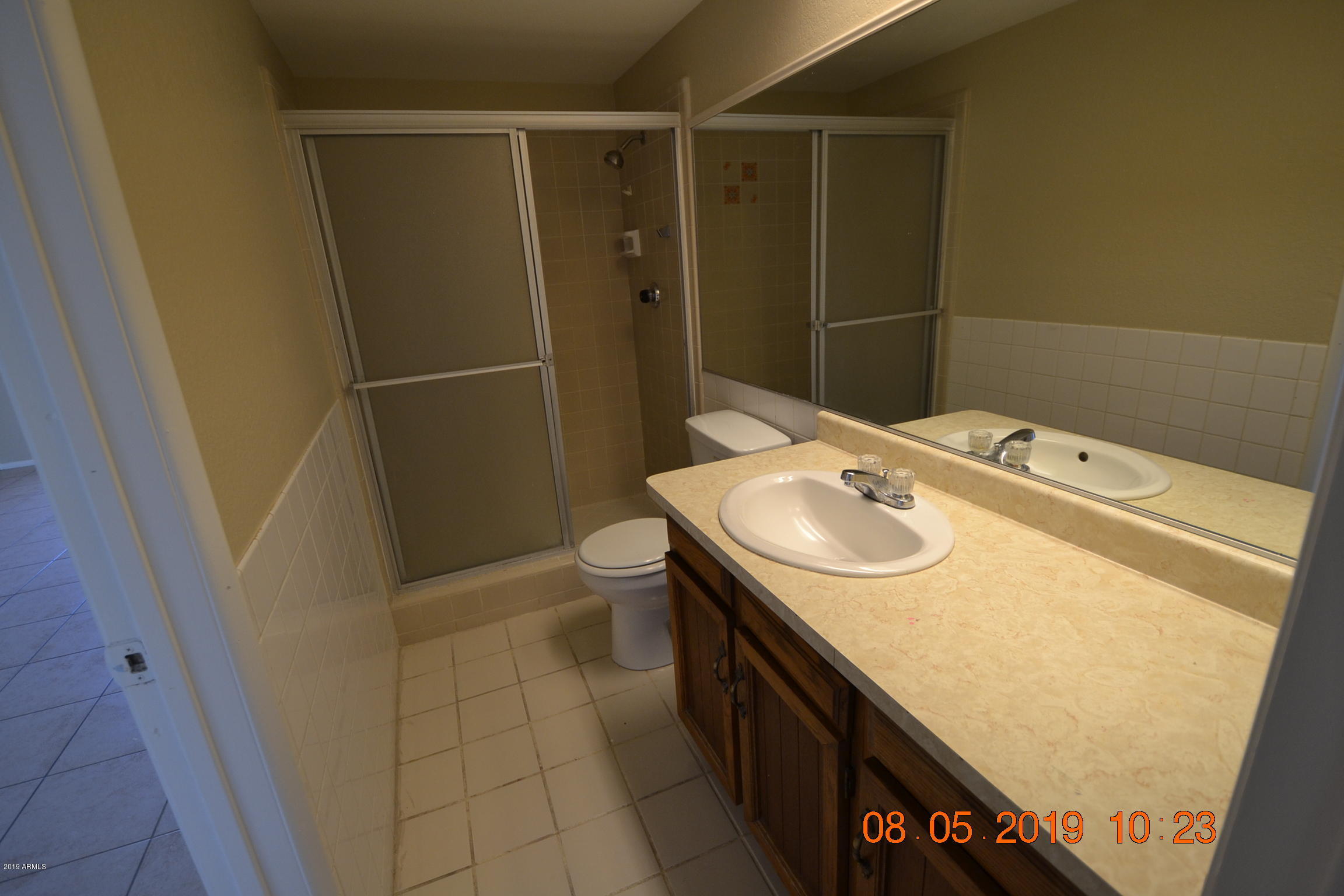 1431 West Behrend Drive Phoenix, AZ 85027 - Photo 11 of 15 a bathroom with a sink a toilet a mirror and shower