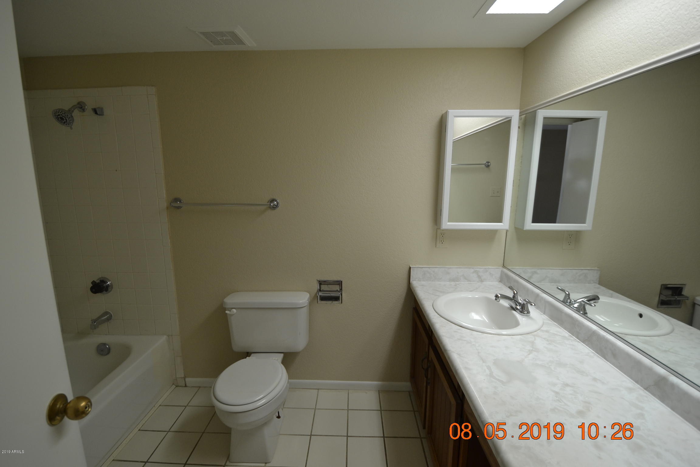 1431 West Behrend Drive Phoenix, AZ 85027 - Photo 13 of 15 a bathroom with a granite countertop sink a toilet and shower