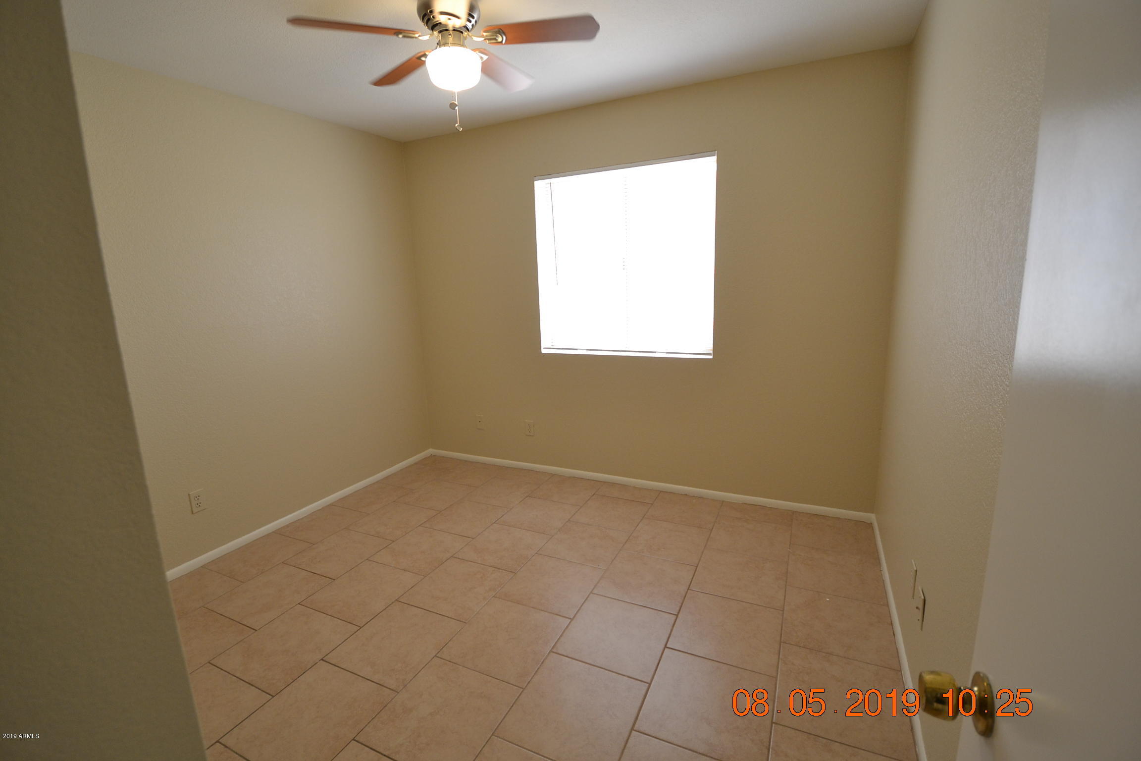 1431 West Behrend Drive Phoenix, AZ 85027 - Photo 14 of 15 an empty room with a window