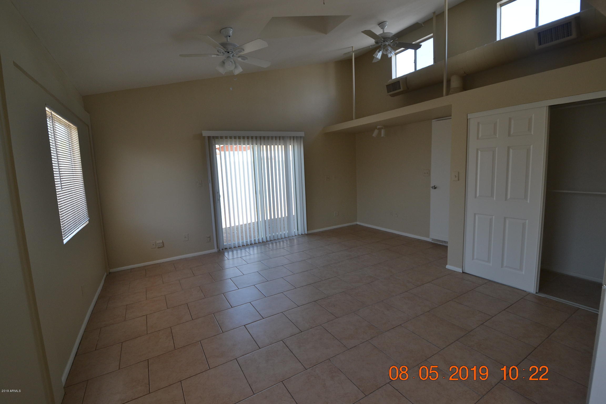 1431 West Behrend Drive Phoenix, AZ 85027 - Photo 7 of 15 an empty room with windows
