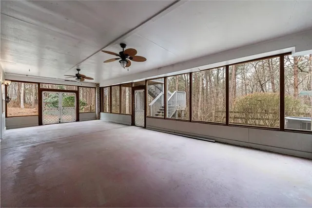 a view of an empty room with a large window