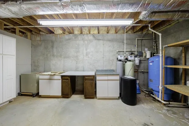 a view of empty room with wooden walls
