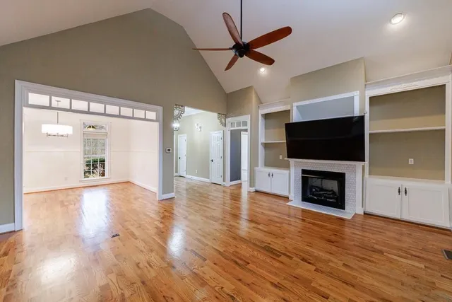 a view of a livingroom with an empty space and a fireplace