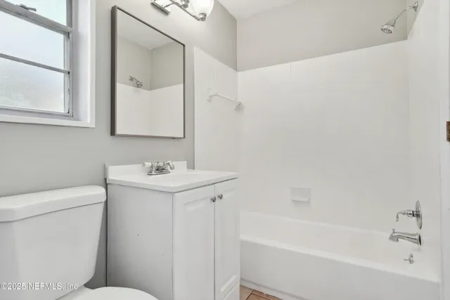 a bathroom with a sink a toilet and a bathtub