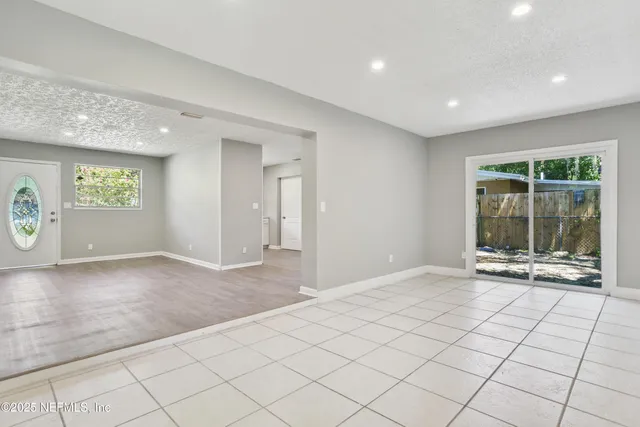 a view of an empty room and window