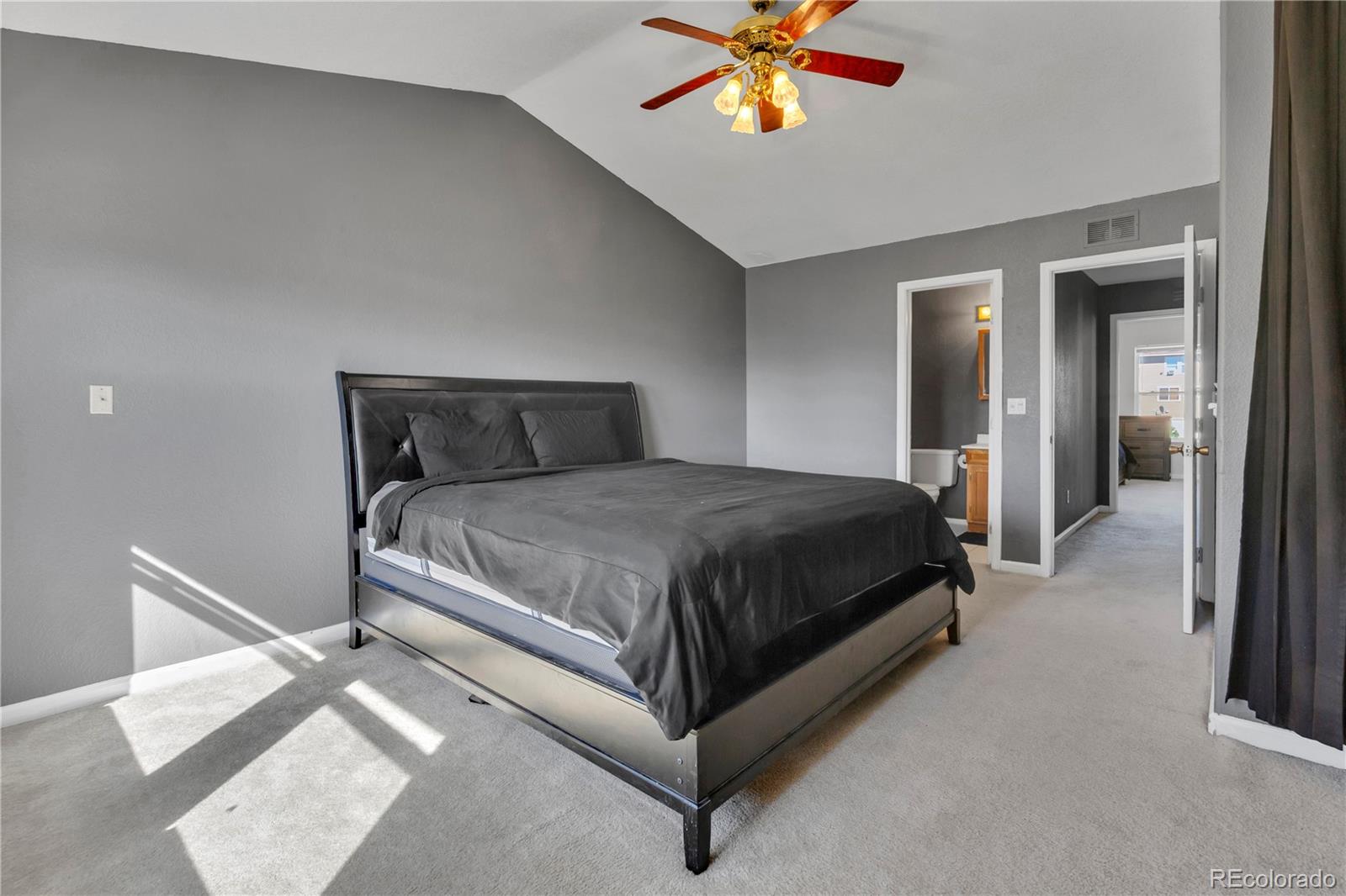3300 West Florida Avenue, Unit 80 Denver, CO 80219 - Photo 11 of 24 a bedroom with a bed and a chandelier