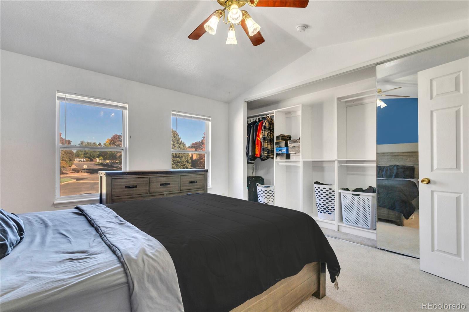 3300 West Florida Avenue, Unit 80 Denver, CO 80219 - Photo 16 of 24 a bedroom with a large bed and a window