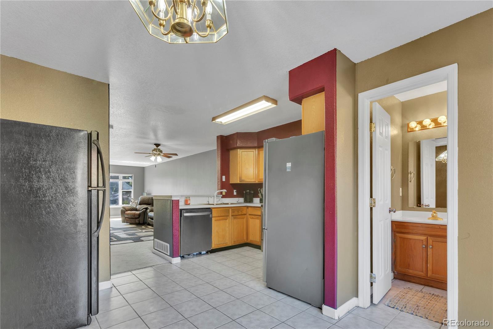 3300 West Florida Avenue, Unit 80 Denver, CO 80219 - Photo 4 of 24 a kitchen with stainless steel appliances granite countertop a refrigerator and a sink