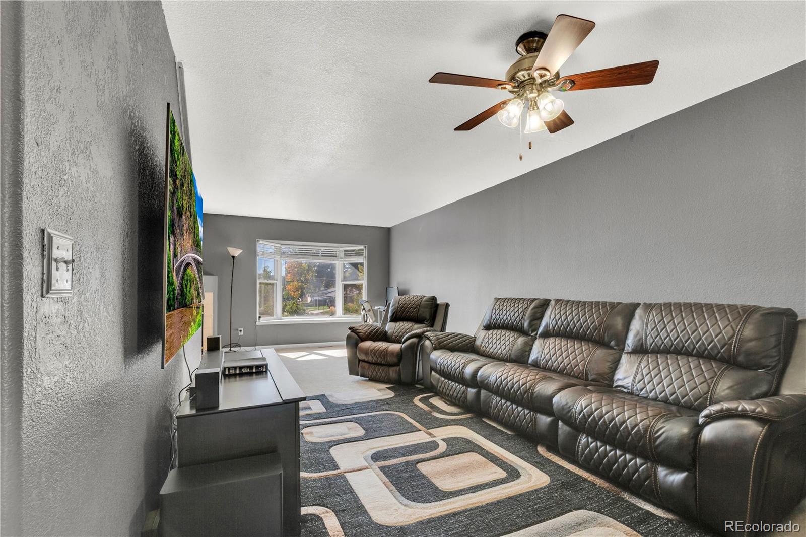 3300 West Florida Avenue, Unit 80 Denver, CO 80219 - Photo 7 of 24 a living room with furniture