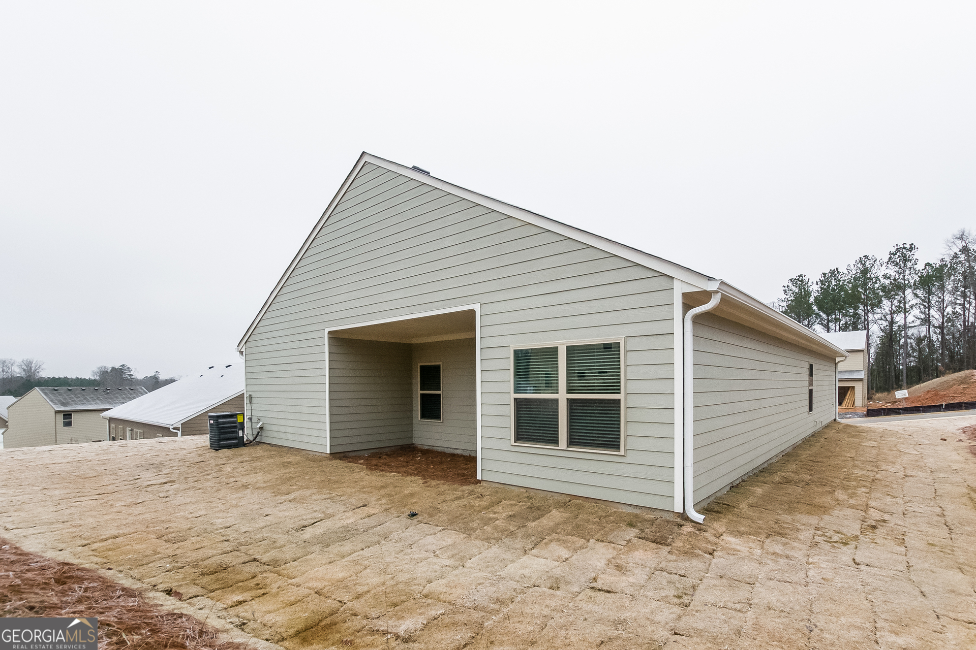 16 Sycamore Street Cartersville, GA 30120 - Photo 14 of 15 a view of a house with a backyard and garage