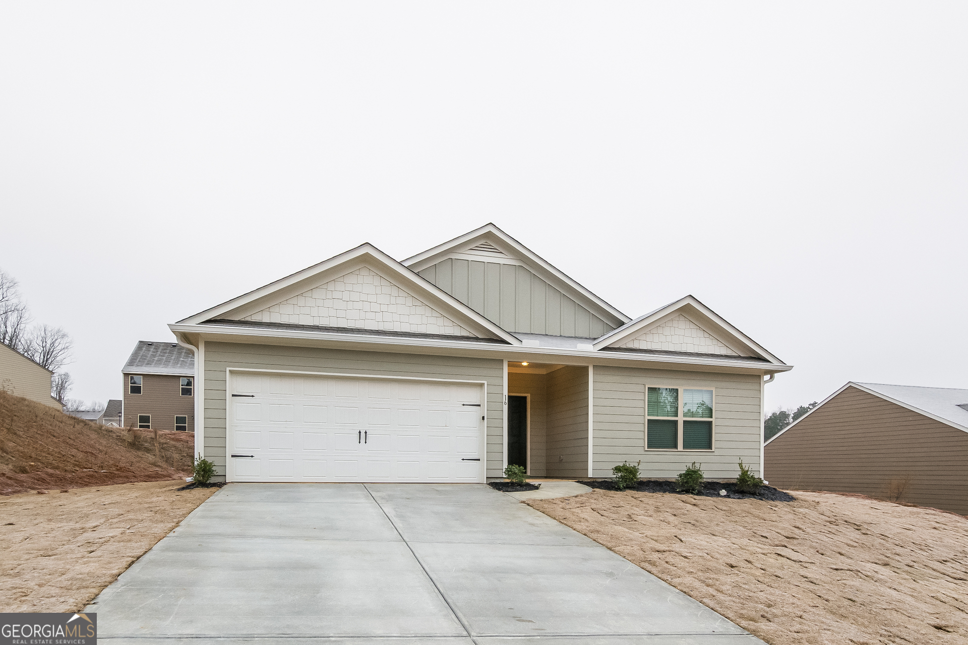 16 Sycamore Street Cartersville, GA 30120 - Photo 2 of 15 a view of a house with a yard and garage