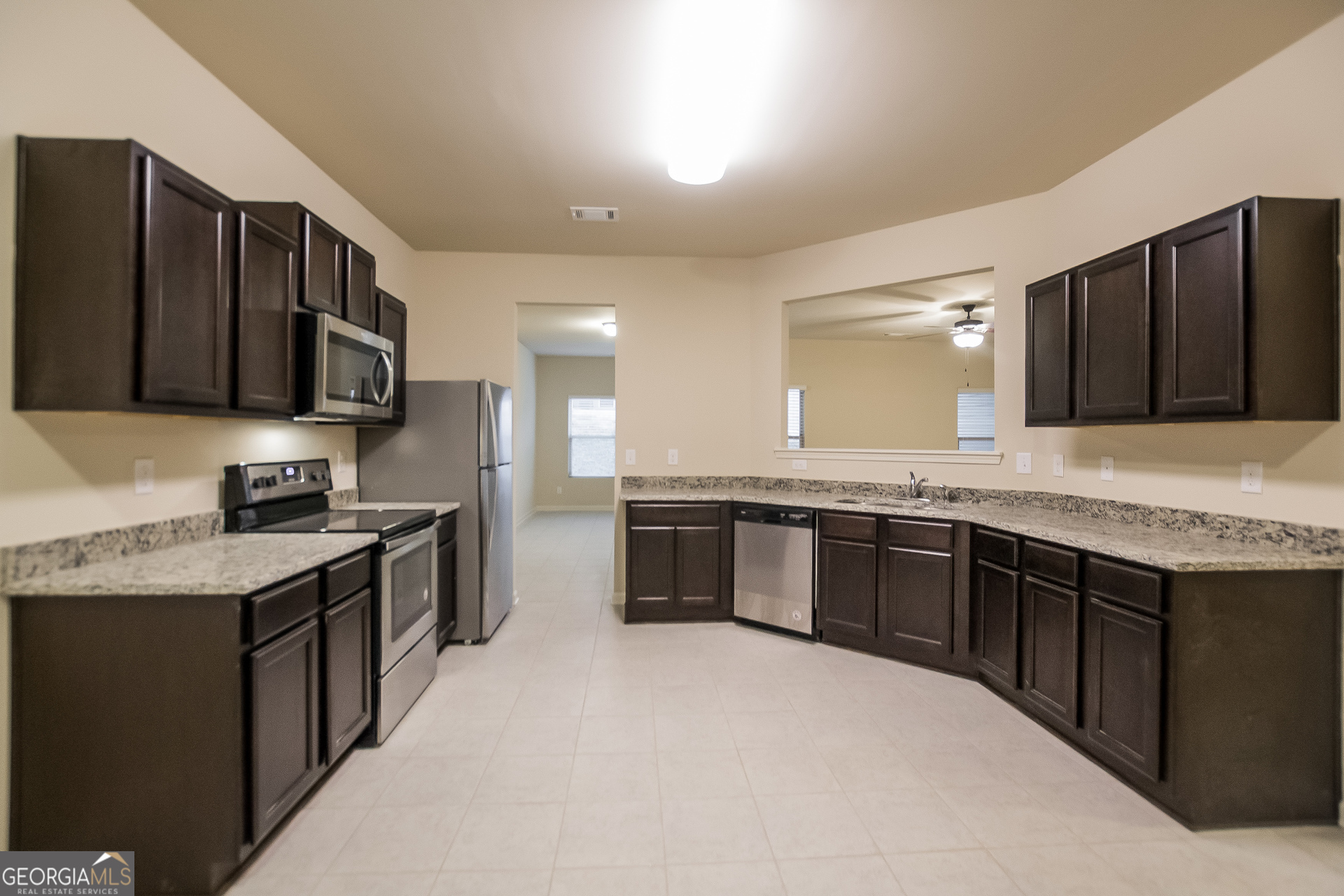 16 Sycamore Street Cartersville, GA 30120 - Photo 6 of 15 a large kitchen with granite countertop a sink and cabinets