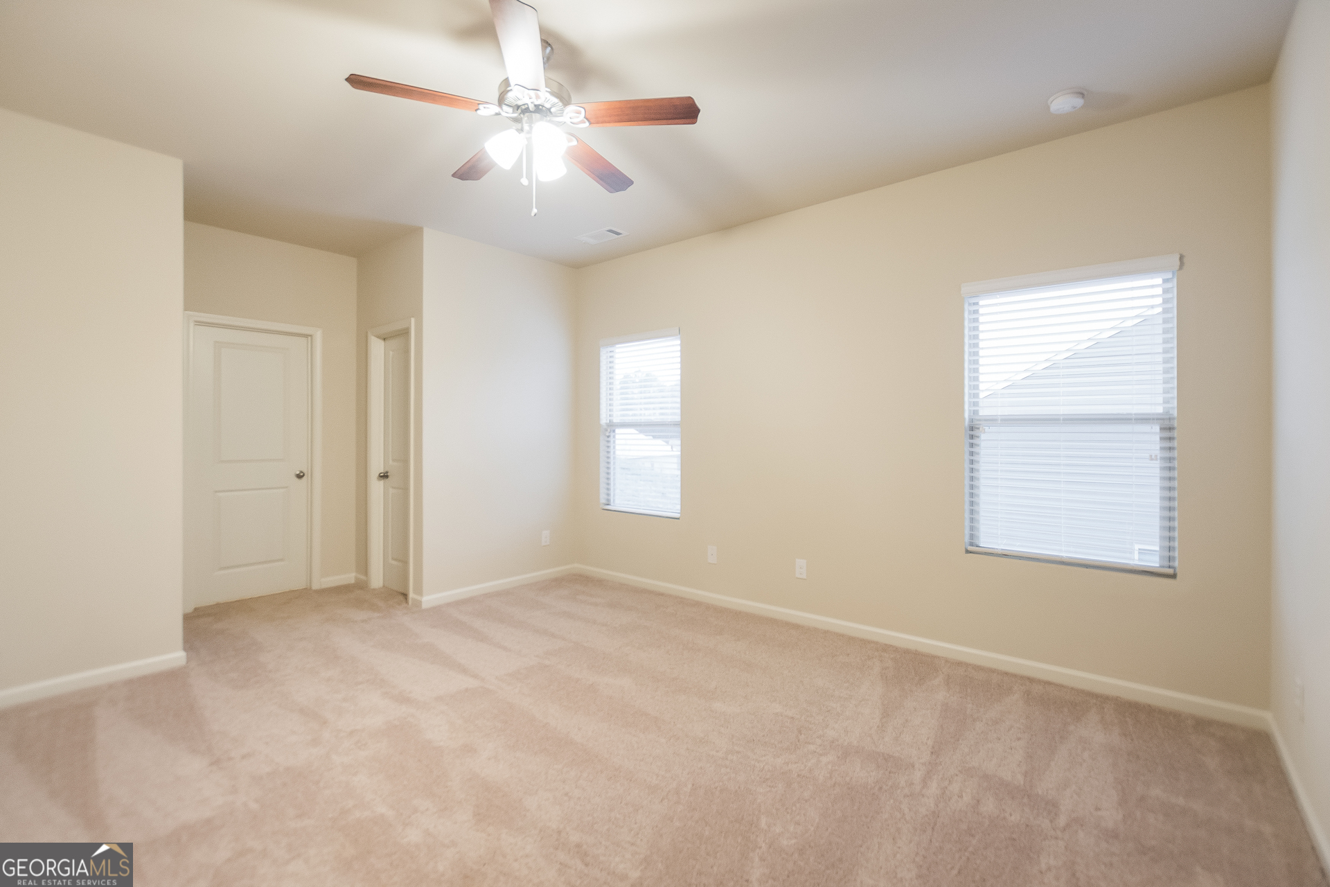 16 Sycamore Street Cartersville, GA 30120 - Photo 8 of 15 an empty room with windows and fan