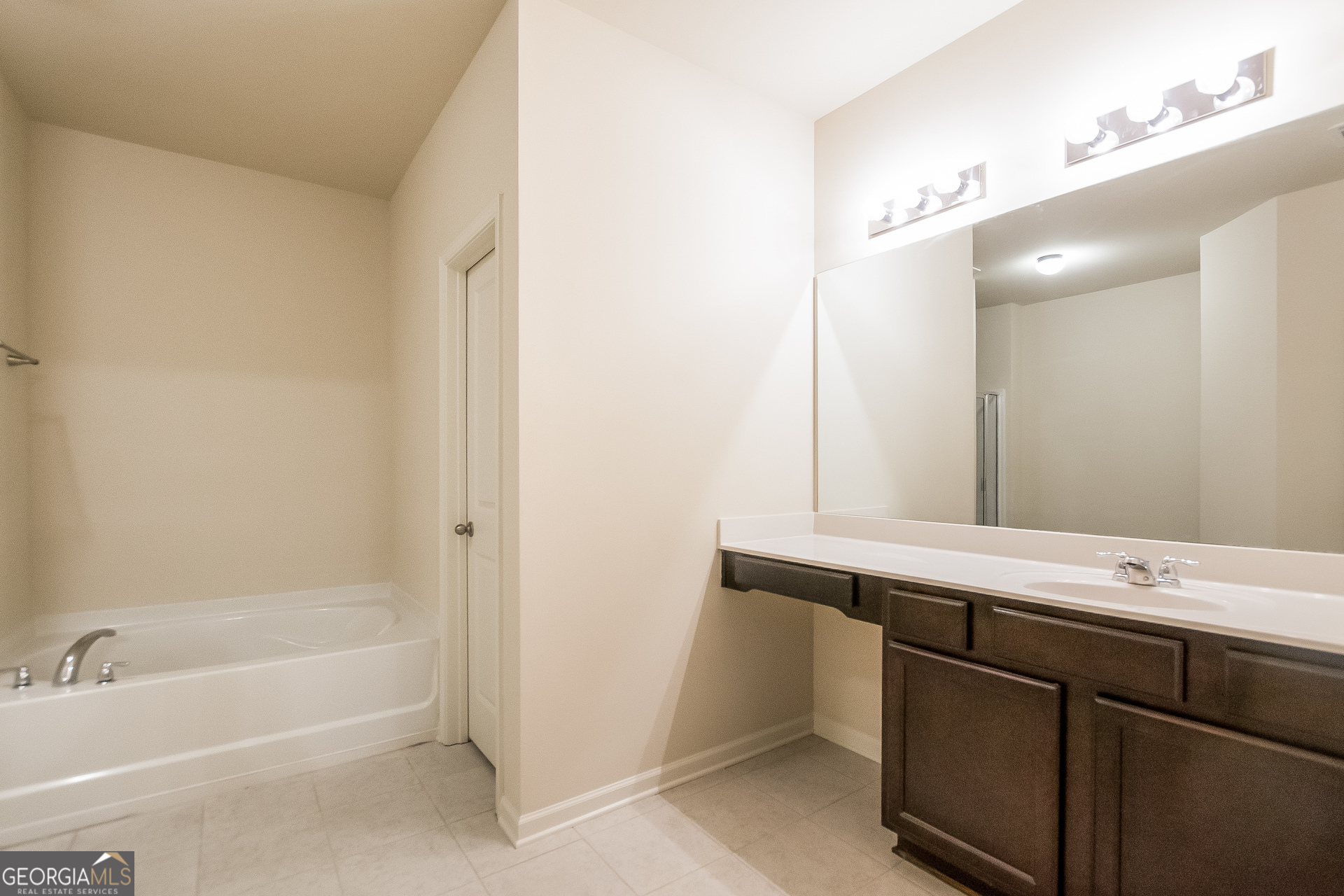 16 Sycamore Street Cartersville, GA 30120 - Photo 10 of 15 a bathroom with a bathtub and a sink