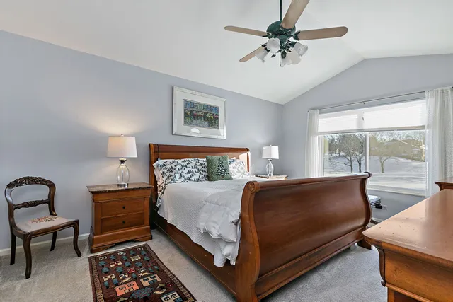 a bed room with a bed and a chandelier