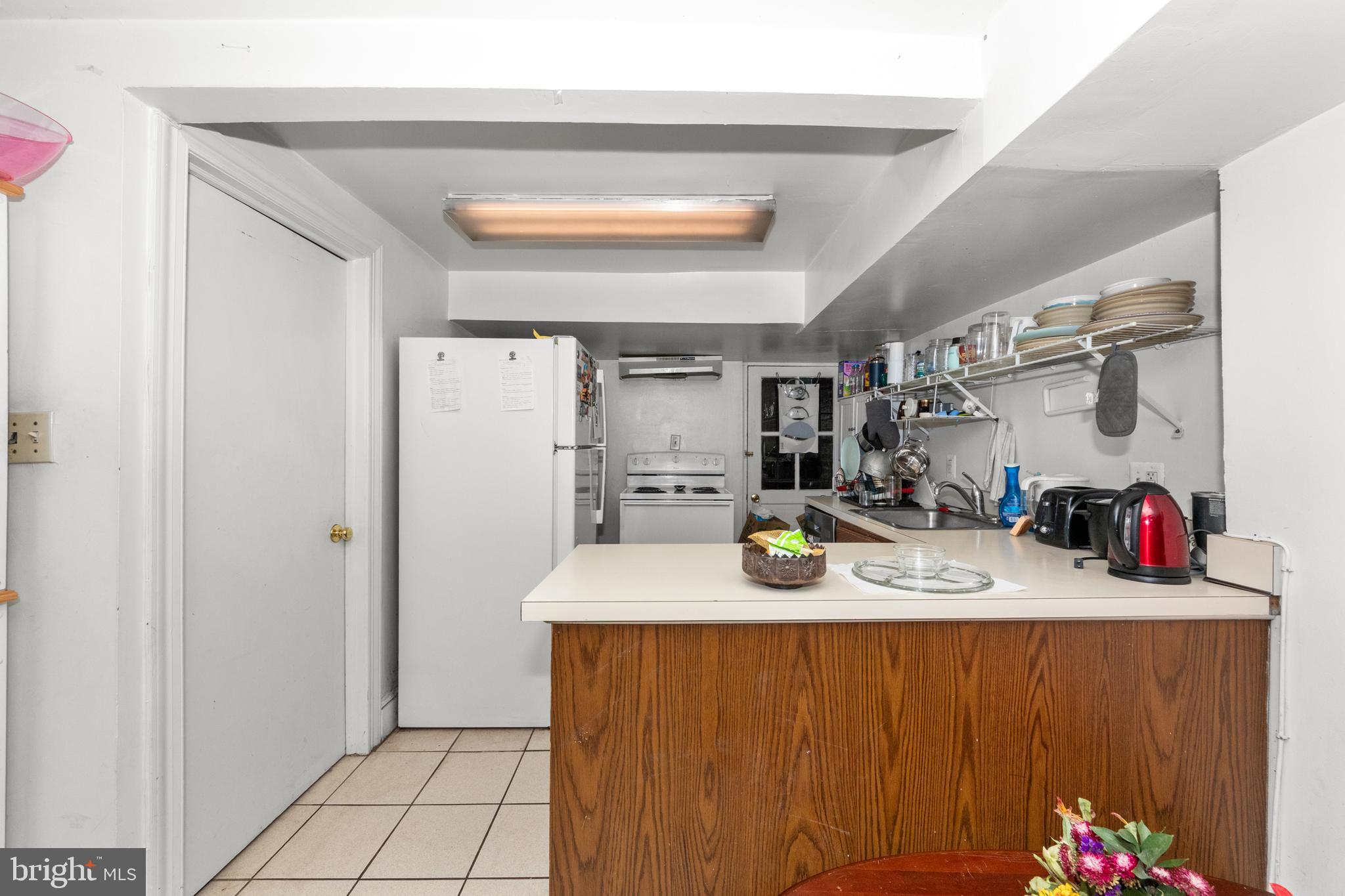 1013 Independence Avenue Southeast Washington, DC 20003 - Photo 12 of 35 a room with stainless steel appliances kitchen island granite countertop a refrigerator and a stove