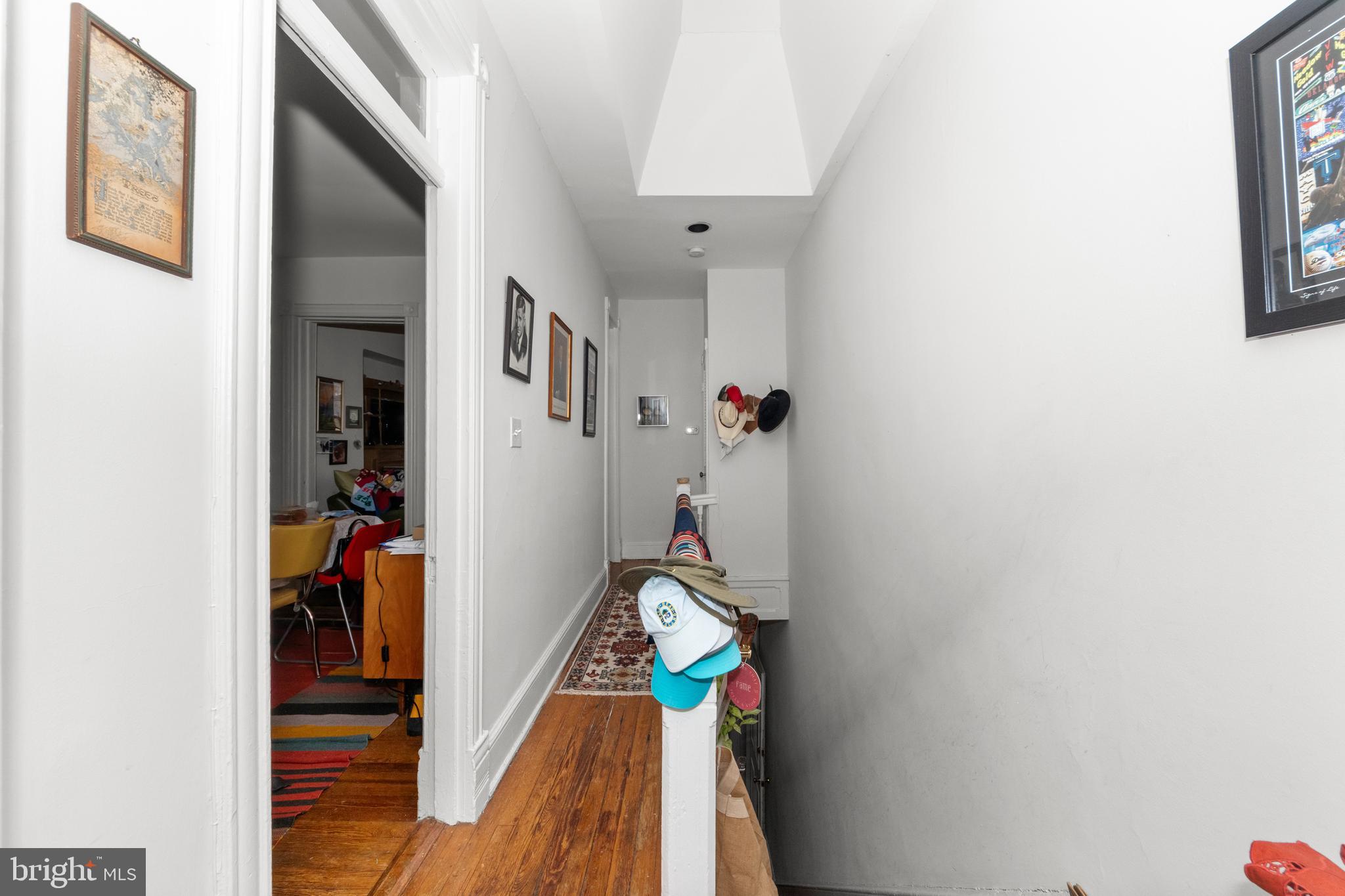 1013 Independence Avenue Southeast Washington, DC 20003 - Photo 17 of 35 a hallway with painting on the wall and a window