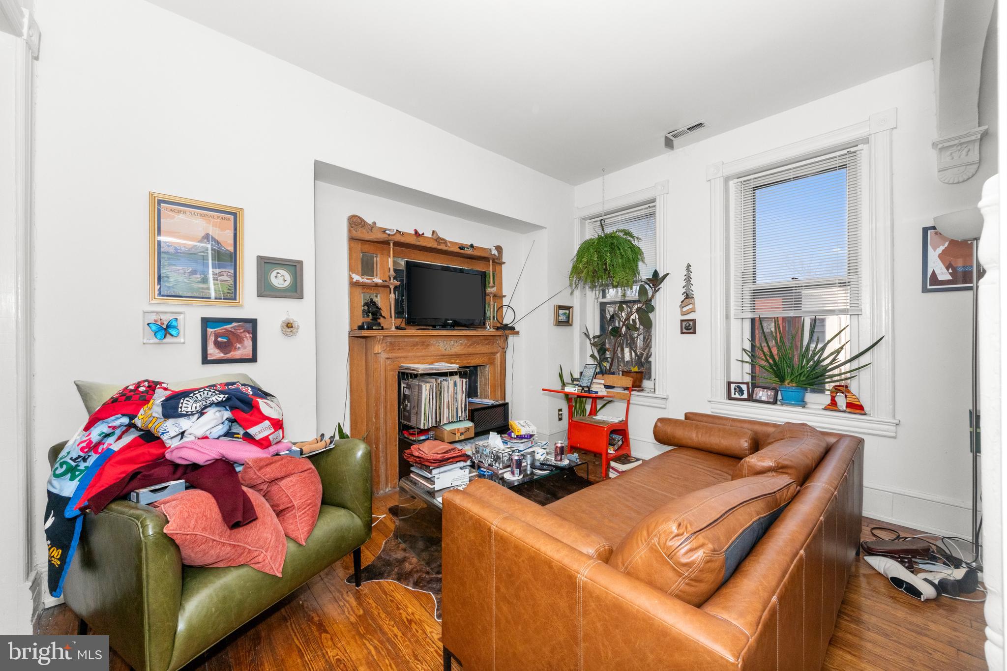 1013 Independence Avenue Southeast Washington, DC 20003 - Photo 18 of 35 a living room with furniture a flat screen tv and a fireplace