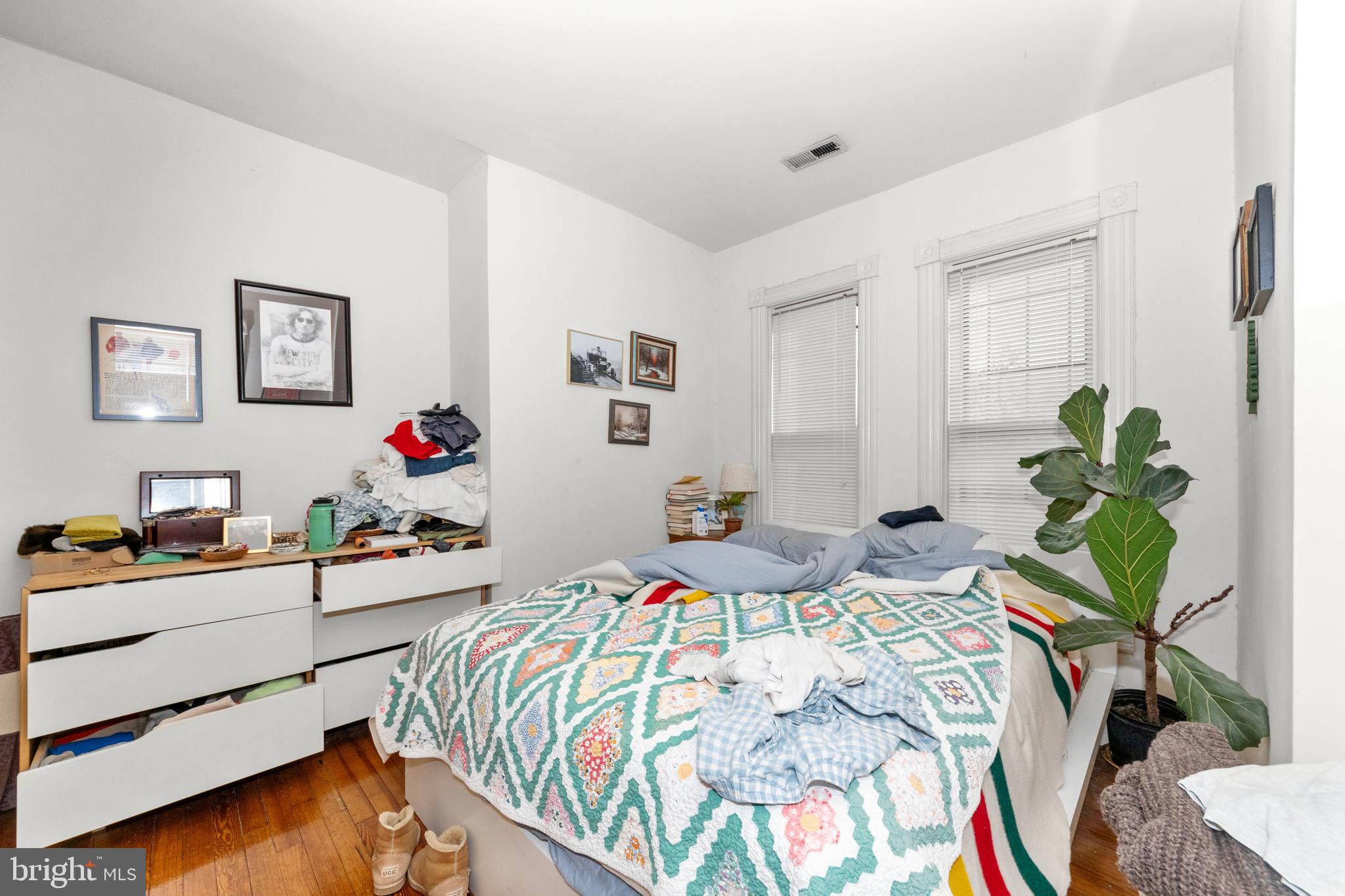 1013 Independence Avenue Southeast Washington, DC 20003 - Photo 28 of 35 a bedroom that has a bed and a table in it