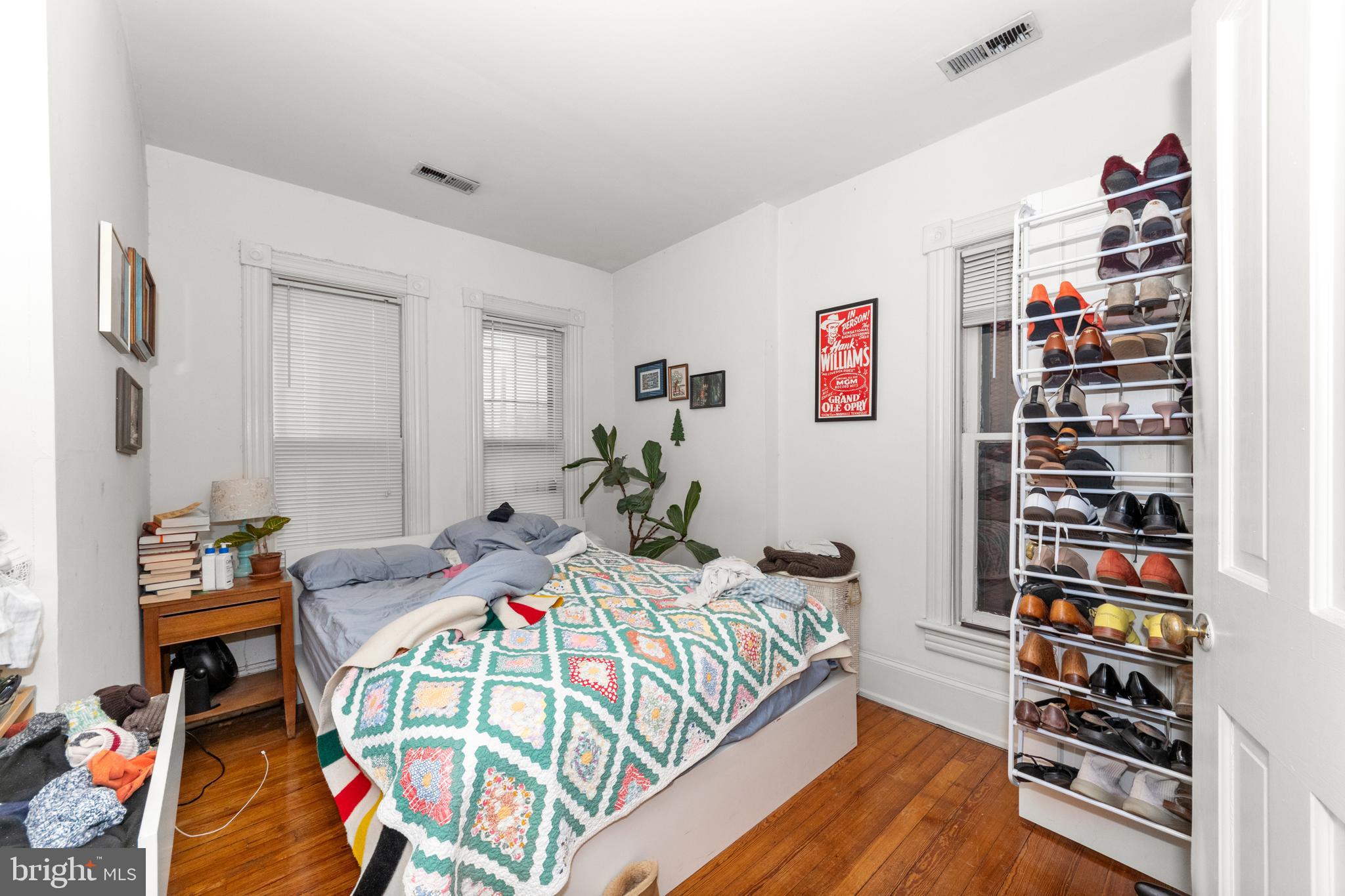 1013 Independence Avenue Southeast Washington, DC 20003 - Photo 29 of 35 a bedroom with furniture and a book shelf