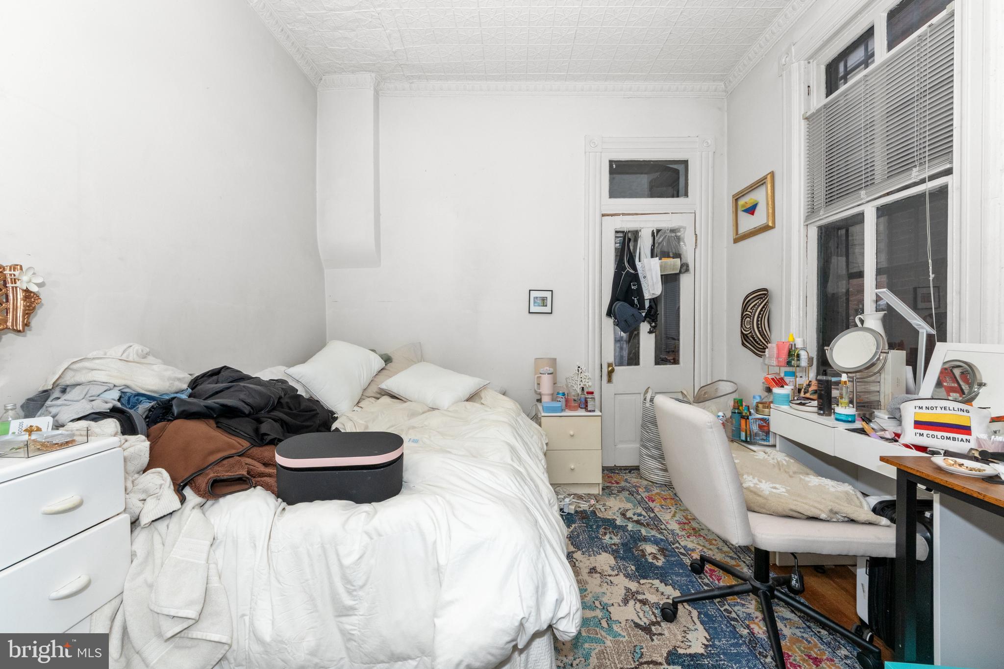 1013 Independence Avenue Southeast Washington, DC 20003 - Photo 9 of 35 a bedroom with a bed and a table