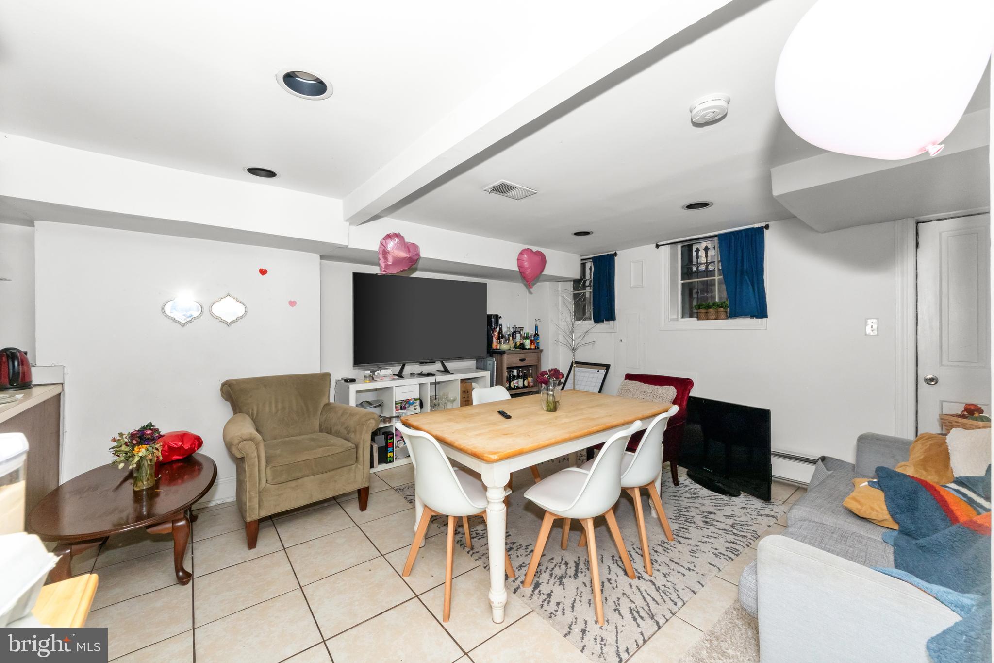 1013 Independence Avenue Southeast Washington, DC 20003 - Photo 10 of 35 a view of a livingroom with furniture and a flat screen tv