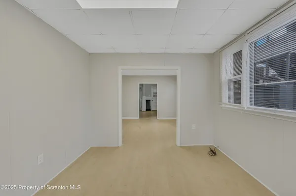 a view of a big room with a windows and cabinet