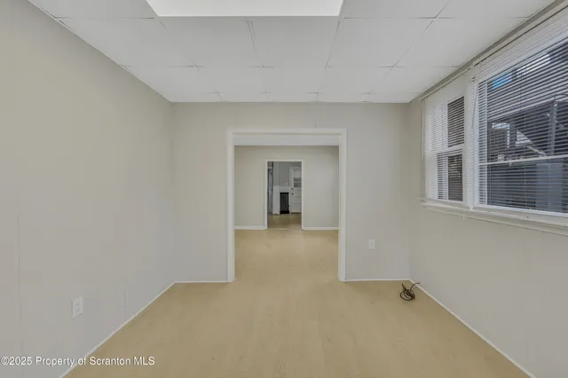 a view of a big room with a windows and cabinet