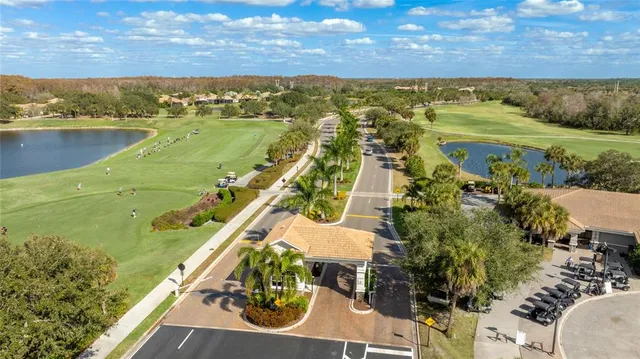 a front view of a house with garden and patio