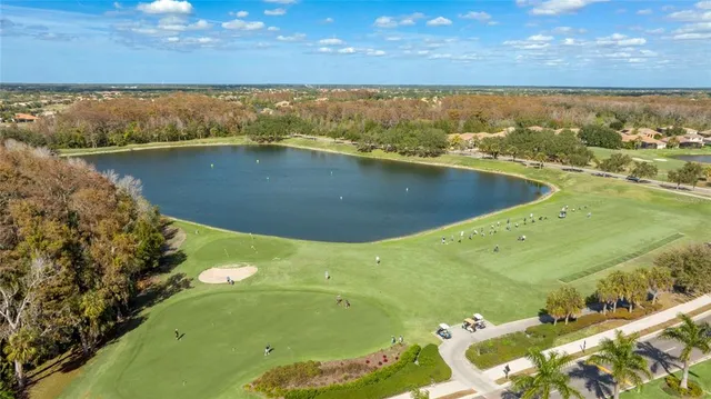 a kitchen with a dining table chairs and white appliances