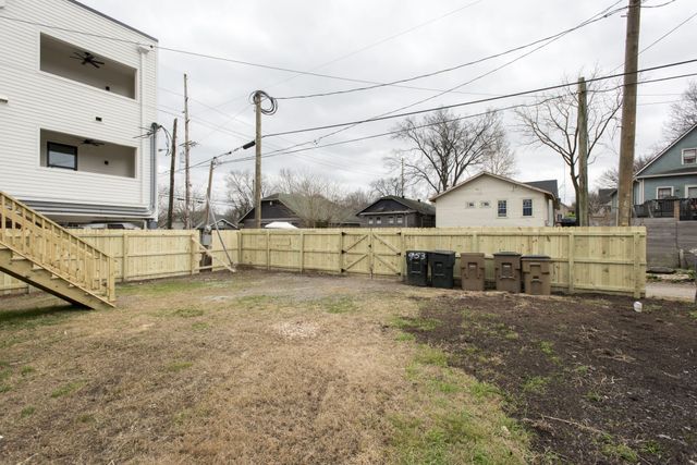 a view of a house with a snow in the yard