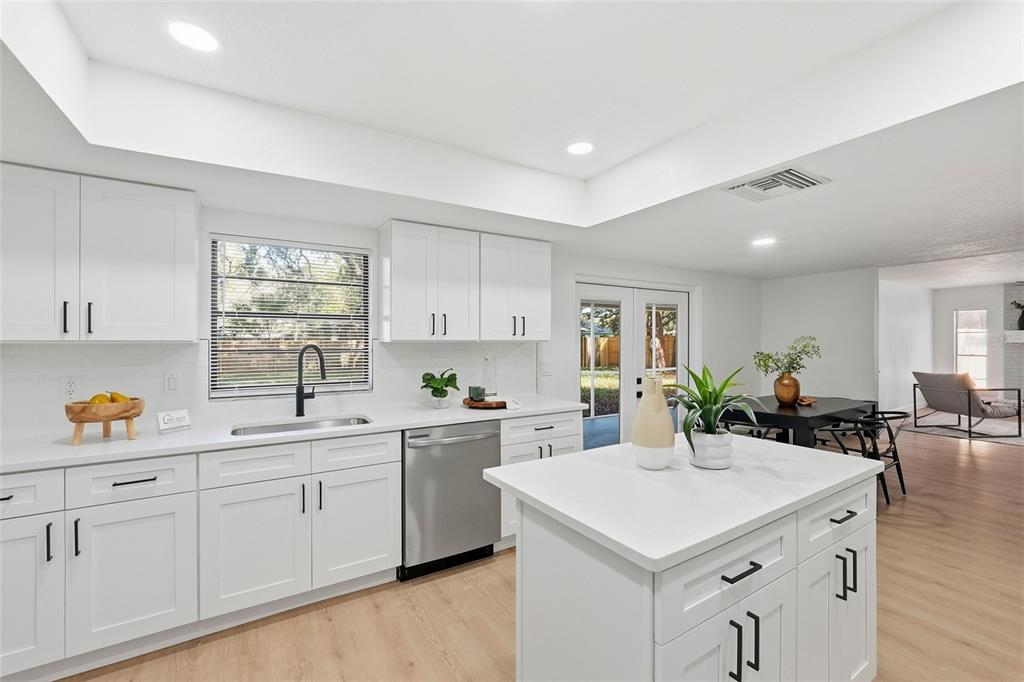 404 Bryan Oak Avenue Brandon, FL 33511 - Photo 15 of 43 a kitchen with a sink a stove and cabinets