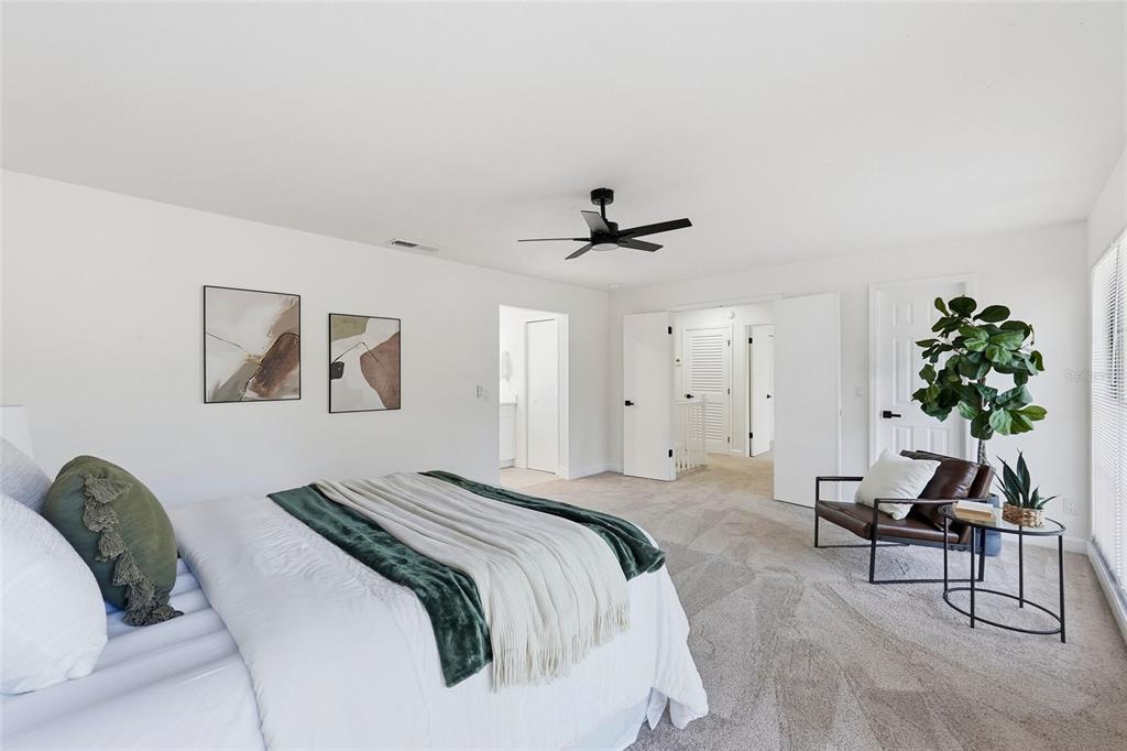 404 Bryan Oak Avenue Brandon, FL 33511 - Photo 17 of 43 a bedroom with a bed and a potted plant