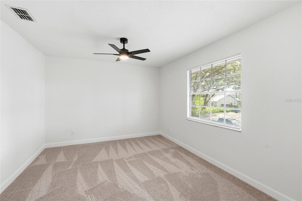 404 Bryan Oak Avenue Brandon, FL 33511 - Photo 27 of 43 an empty room with windows and fan